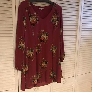 Upper thigh length loose fitting dress.